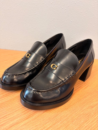 Coach 8.5 Black heeled leather loafer w/ gold "C"