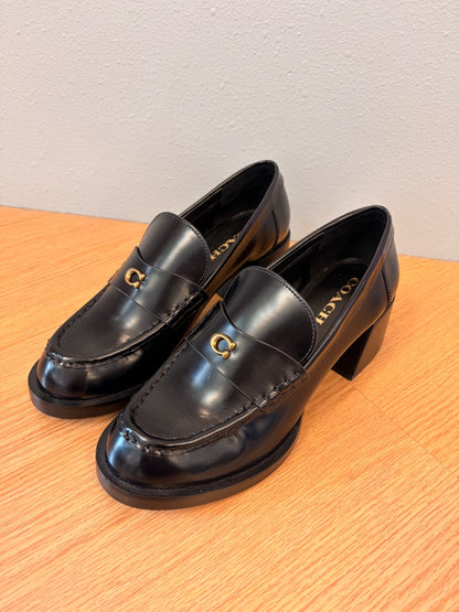 Coach 8.5 Black heeled leather loafer w/ gold "C"