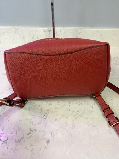 Micheal Kors  Red Leather backpack w/ gold hardware/multiple zips